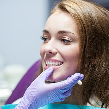 A woman at the dentist getting a dental crown