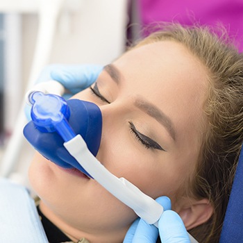 Woman with nitrous oxide nasal mask