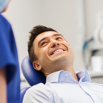 Smiling man in dental chair