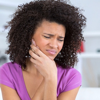 Pained woman with toothache in Oak Cliffs