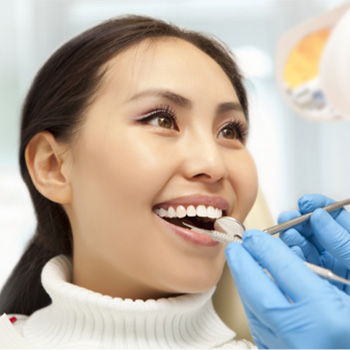 Woman receiving dental treatment