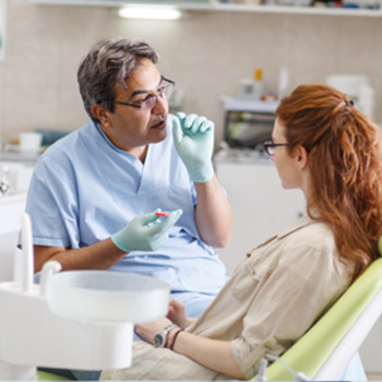 Dentist explaining treatment to patient 