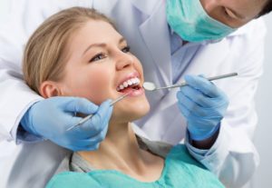 dentist tending to patient