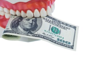 teeth holding money
