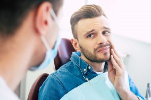 person experiencing a dental emergency