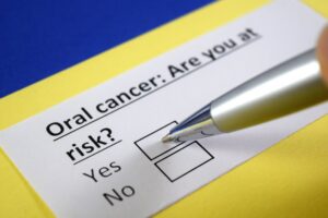 Patient filling out oral cancer questionnaire 
